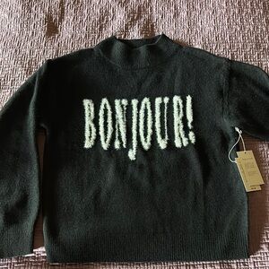 Black Sweater with 'Bonjour!' Text